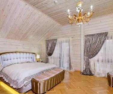 Фото спальня дерев'яному в будинку з клеєного бруса, побудованого за проектом №2-315 від компанії Аттика