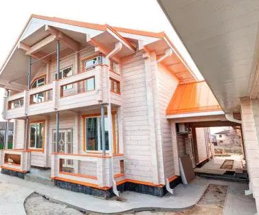 Фото фасада деревянного коттеджа построенного по проекту №2-470 от компании Аттика